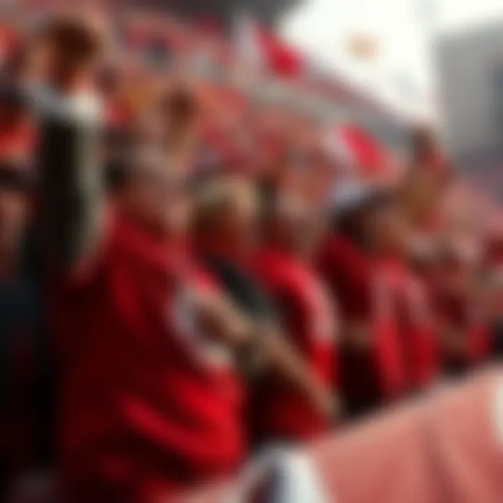 Excited fans in Ohio State gear cheer wildly after a thrilling play during the first quarter.