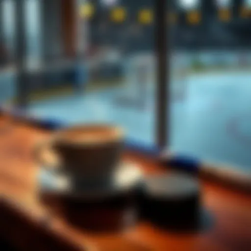 A steaming cup of coffee next to a hockey stick and puck on a wooden table, symbolizing a perfect morning routine.