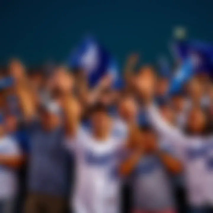 Excited Los Angeles Dodgers fans cheering with team flags and jerseys during a game
