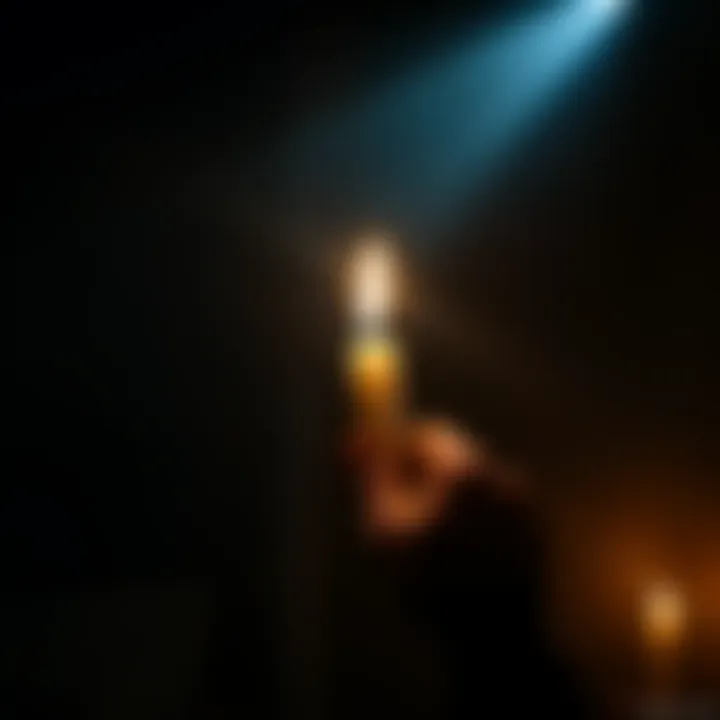 A person holding a candle in a dark room, symbolizing hope and faith during hard times