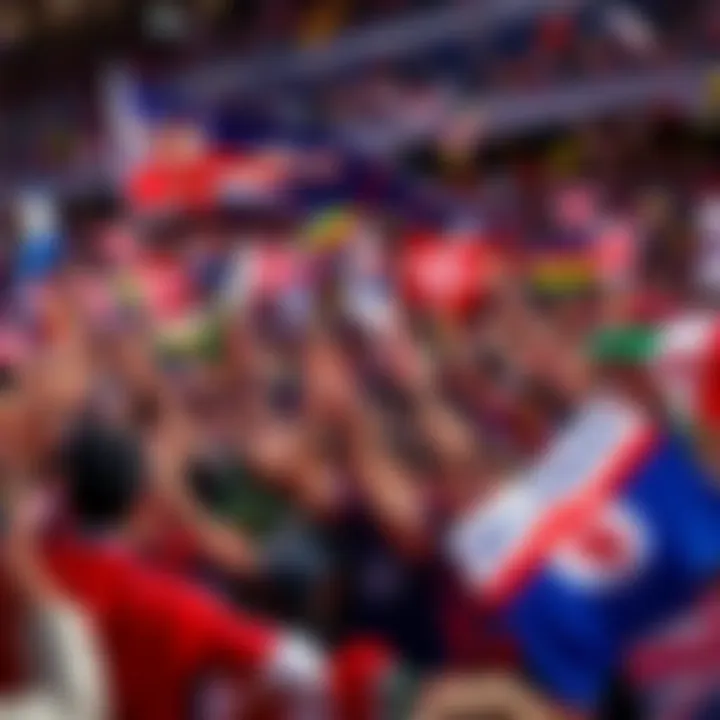 Crowd of soccer fans cheering with flags and team colors as the Premier League returns