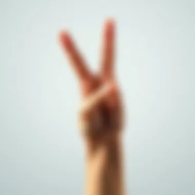 A close-up of a hand making the crossed fingers gesture, representing hope and good luck, with a light background.