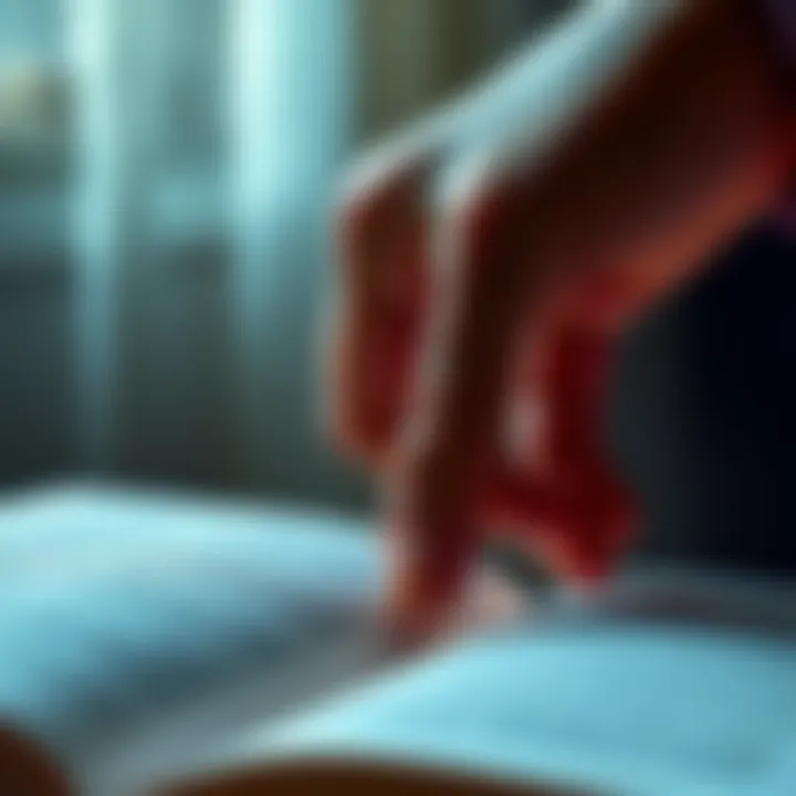 A person's hand turning a page in a book, symbolizing the continuation of a narrative