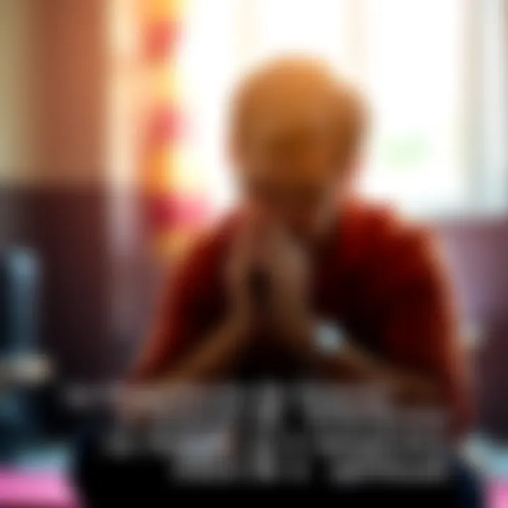 A person sitting quietly with hands clasped in prayer, creating a peaceful atmosphere.