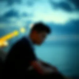 A thoughtful person sitting alone, looking pensive, evoking feelings of nostalgia and shared experiences.