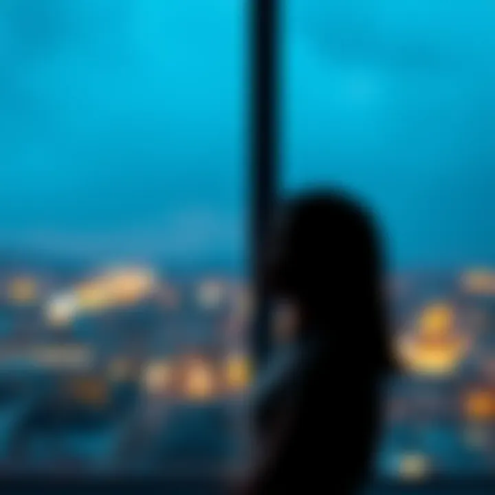 A person looking out a window, contemplating their journey of sobriety and self-acceptance.