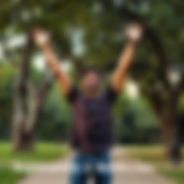 A person with a joyful expression standing with arms raised in a park, symbolizing success in recovery from gambling addiction