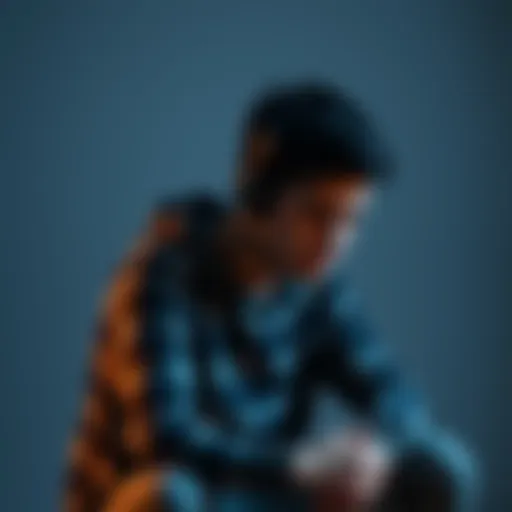 Young man reflecting on game losses Eighteen-year-old man sitting alone, looking concerned as he thinks about his money lost in gaming. He appears distressed and contemplative about his future.